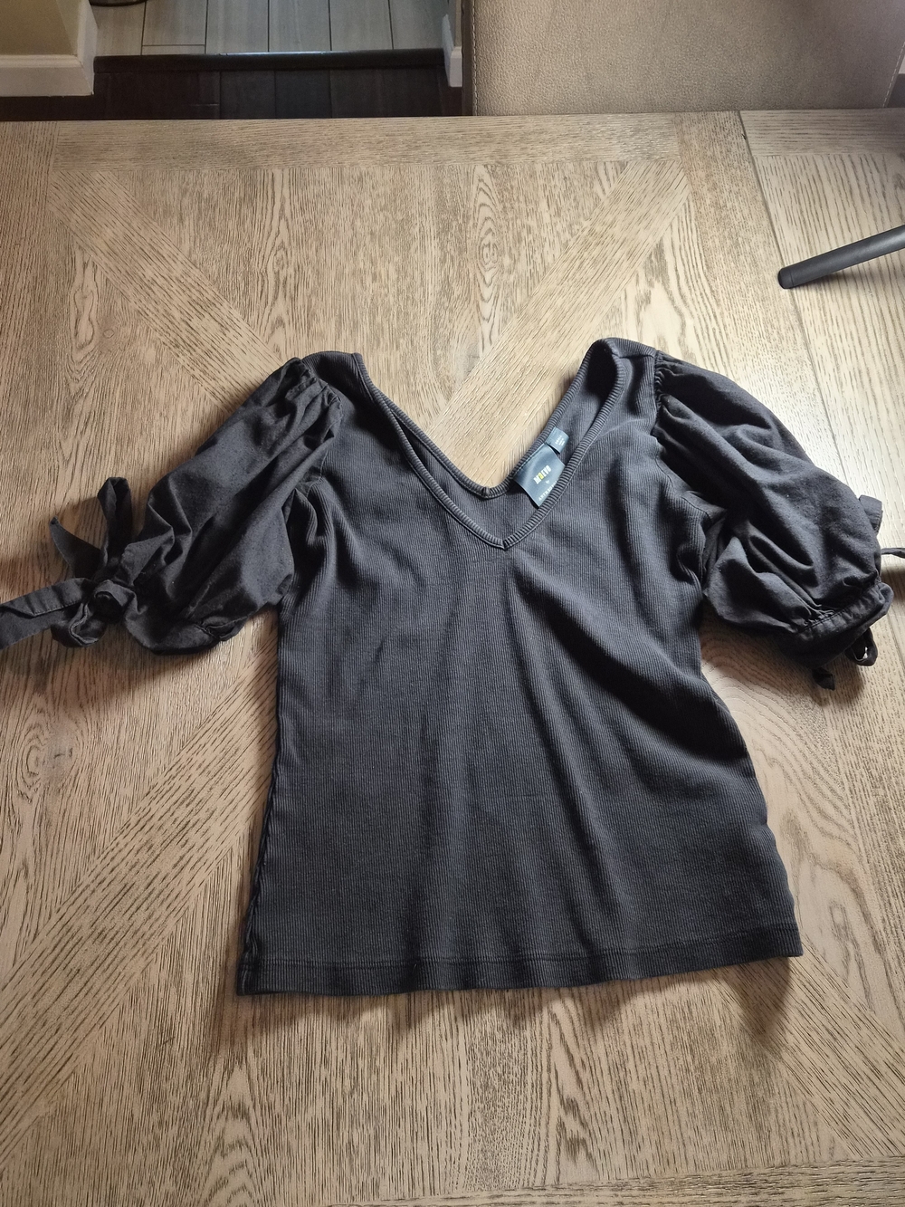 Anthropologie Black V-Neck Puff Sleeve Top with Tie Cuffs